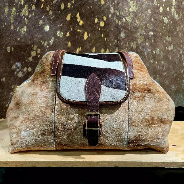 Ref. 701 — Brindle hide duffel bag with striped buckle flap