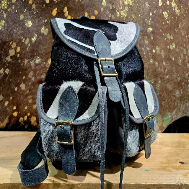 Ref. 842 — Cowhide backpack with buckled front pockets