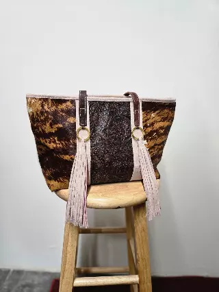 Ref 712 — Brindle hide tote with tooled floral panel