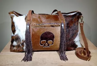 Ref. 412 — Hair-on hide weekender bag with skull applique