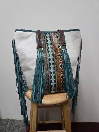 Ref 714 — White hide tote with teal fringe and tassels